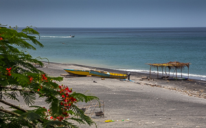 Fishing Boats on a Beach. Silt washed down from the Mountains by Tropical Storm Erika.